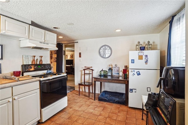 kitchen featuring white cabinets, a textured ceiling, white fridge, and electric range