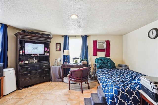 tiled bedroom featuring a textured ceiling and an AC wall unit