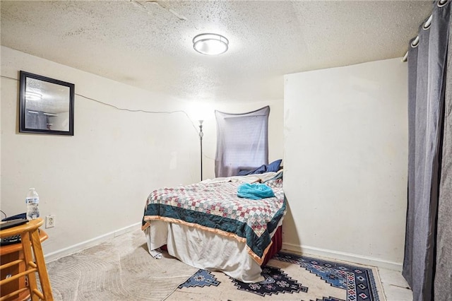 bedroom featuring a textured ceiling