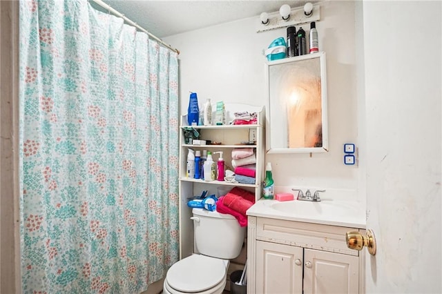 bathroom featuring vanity, toilet, and a shower with shower curtain