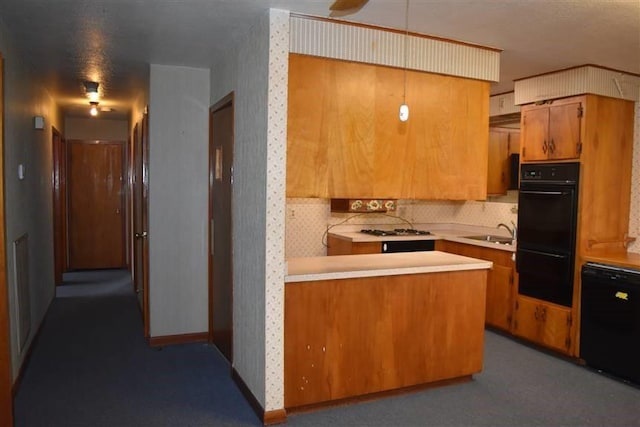 1668 2nd St, Lutcher, LA 70071 - kitchen featuring sink, tasteful backsplash, gas cooktop, kitchen peninsula, and black double oven