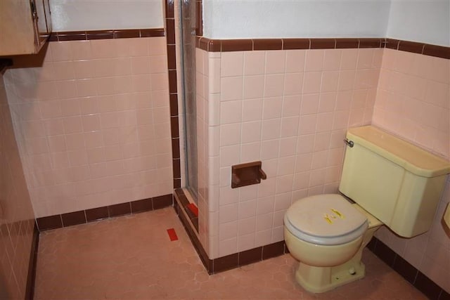 1668 2nd St, Lutcher, LA 70071 - bathroom featuring walk in shower, tile walls, and toilet