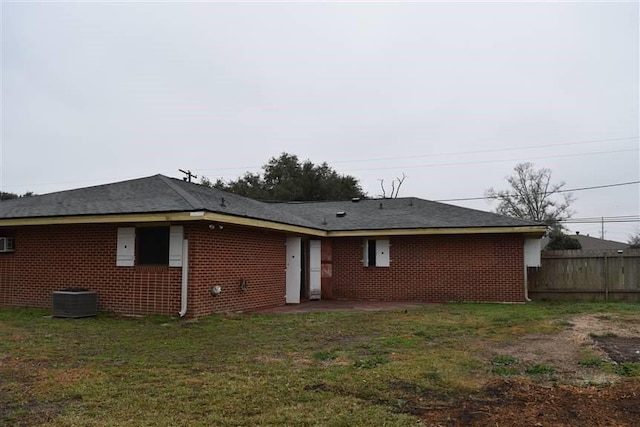 1668 2nd St, Lutcher, LA 70071 - rear view of property featuring central AC unit and a lawn