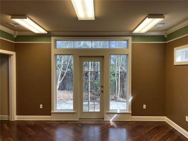 entryway with crown molding and dark hardwood / wood-style floors
