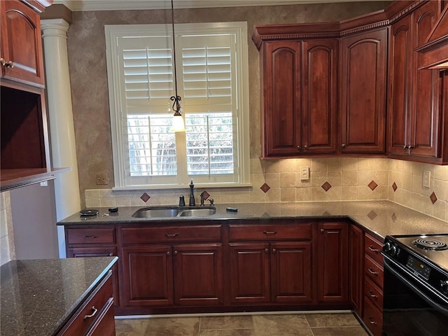 kitchen featuring pendant lighting, sink, dark stone countertops, backsplash, and black range with electric cooktop