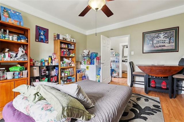 bedroom with ceiling fan and light wood-type flooring