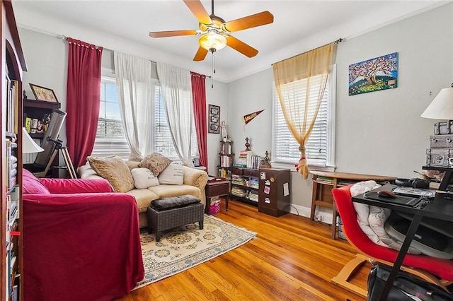 office featuring hardwood / wood-style flooring, plenty of natural light, and ceiling fan