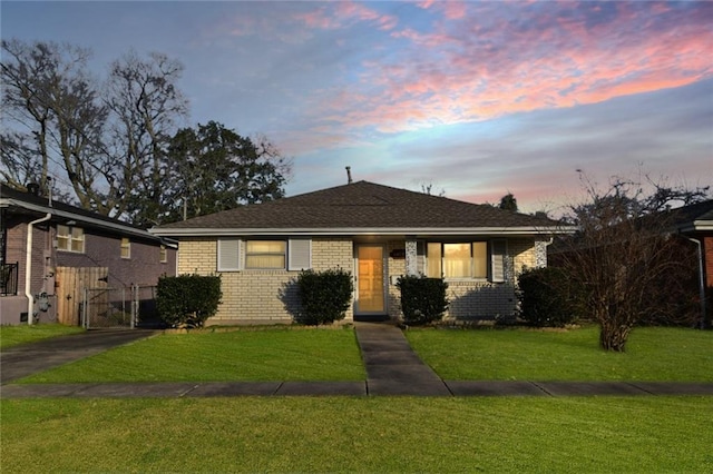 view of front of house with a lawn