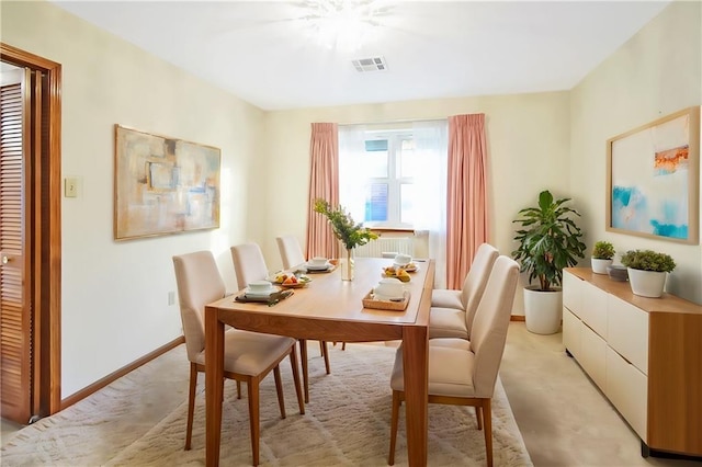 dining area featuring light colored carpet