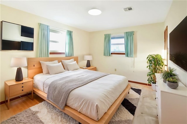 bedroom with light hardwood / wood-style floors