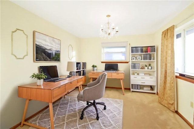 office space with carpet flooring and an inviting chandelier