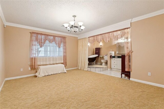 tiled dining space featuring a textured ceiling, ornamental molding, and a healthy amount of sunlight