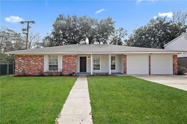 single story home featuring a garage and a front lawn