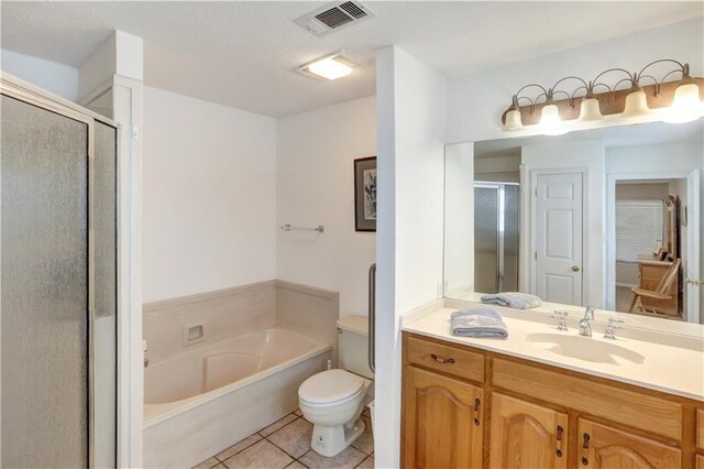 full bathroom featuring vanity, shower with separate bathtub, tile patterned floors, and toilet