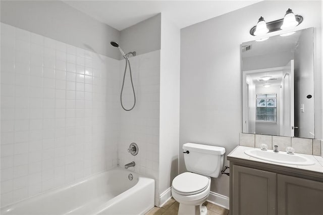 full bathroom with vanity, toilet, tiled shower / bath combo, and tile patterned flooring