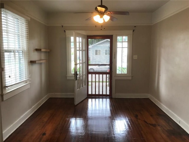 entryway featuring dark wood-type flooring and ceiling fan