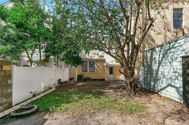 view of yard featuring central air condition unit