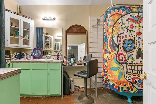 bathroom featuring tile patterned flooring and vanity