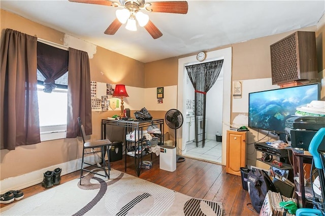 office area with ceiling fan and dark hardwood / wood-style flooring