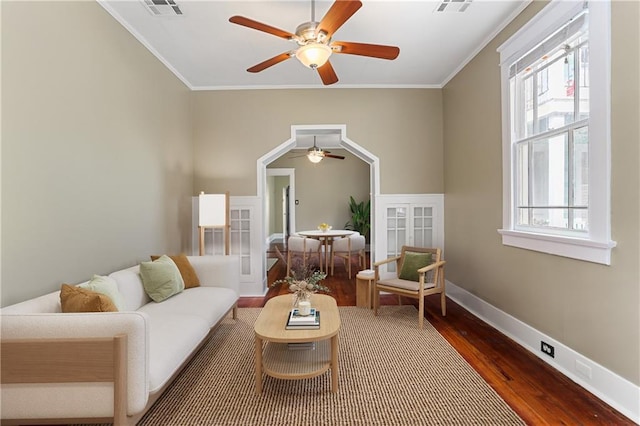 living room featuring hardwood / wood-style flooring and ornamental molding