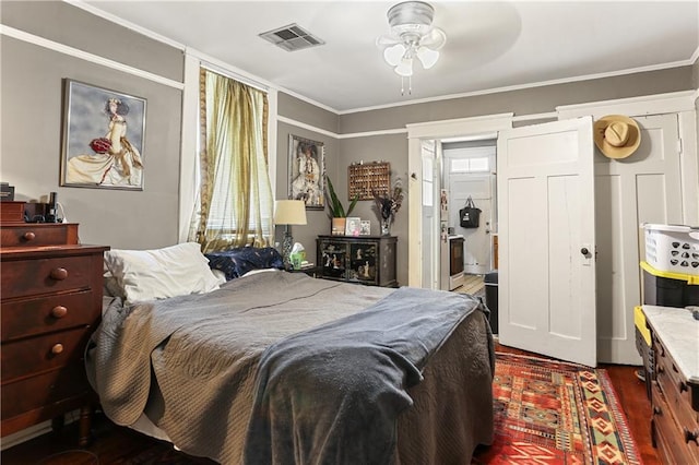 bedroom featuring ornamental molding and dark hardwood / wood-style floors