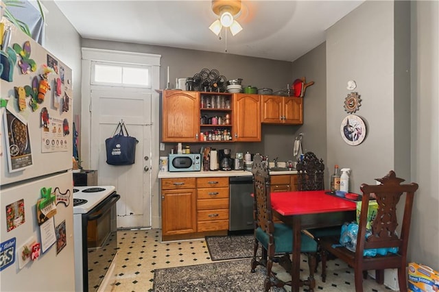 kitchen with electric range oven, built in desk, white refrigerator, stainless steel dishwasher, and ceiling fan