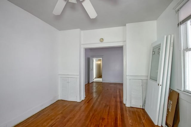 corridor featuring hardwood / wood-style flooring and a wealth of natural light