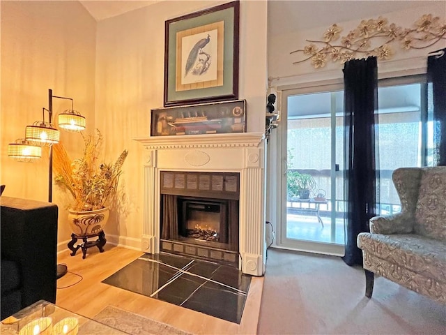 sitting room with hardwood / wood-style floors