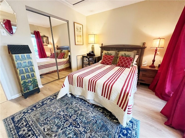 bedroom with a closet and light wood-type flooring