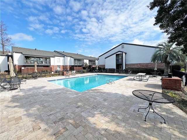 view of swimming pool featuring a patio area