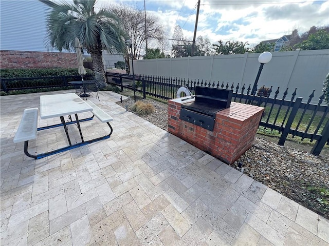 view of patio featuring an outdoor kitchen