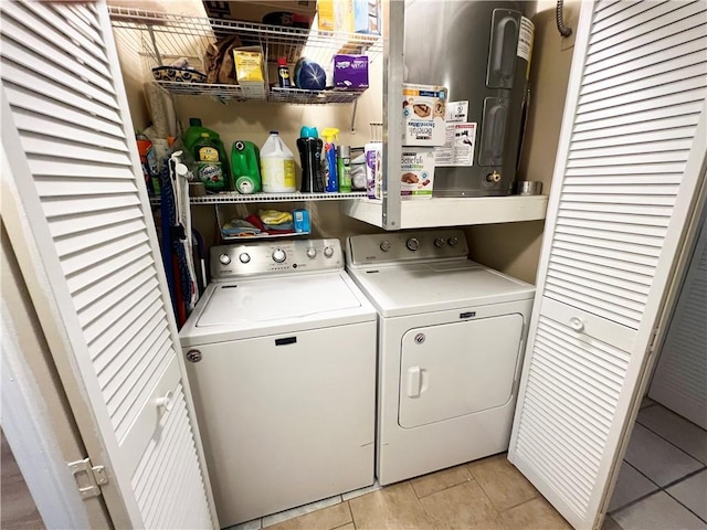 washroom with washer and dryer and light tile patterned floors