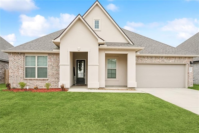 view of front facade with a garage and a front lawn