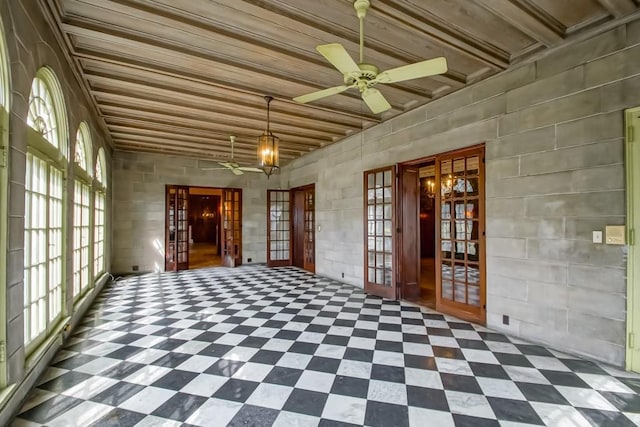 interior space featuring ceiling fan and french doors