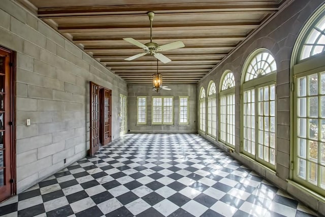 unfurnished sunroom with a wealth of natural light