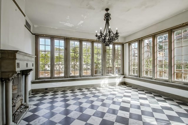 unfurnished sunroom featuring a notable chandelier