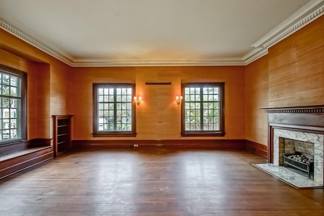 unfurnished living room with ornamental molding, hardwood / wood-style floors, and a high end fireplace