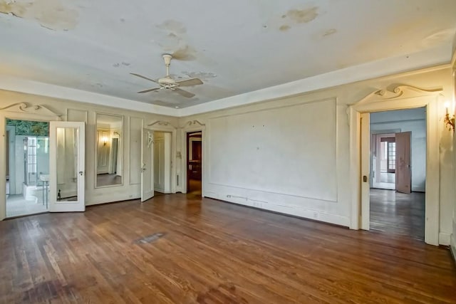 unfurnished room featuring dark hardwood / wood-style floors and ceiling fan