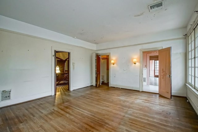 unfurnished room featuring hardwood / wood-style floors