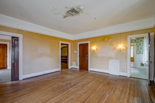 unfurnished room featuring wood-type flooring