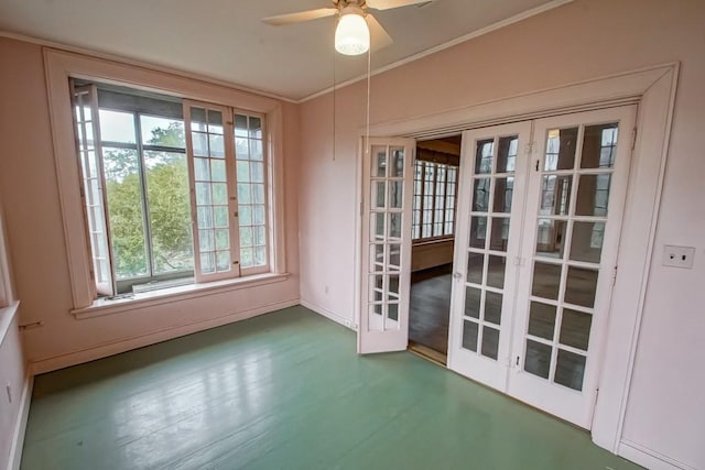 doorway featuring crown molding, wood-type flooring, ceiling fan, and french doors