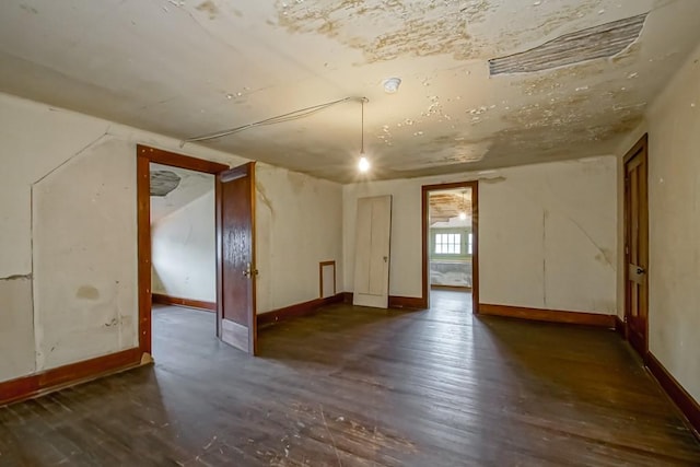 spare room with dark hardwood / wood-style flooring