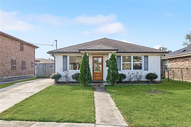 bungalow-style house with a front yard