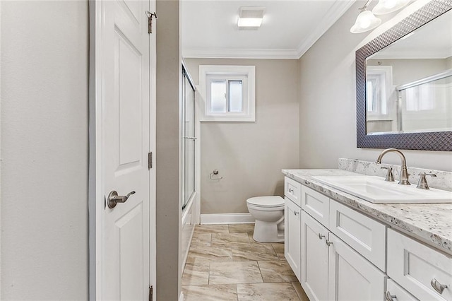 full bathroom with vanity, crown molding, enclosed tub / shower combo, and toilet