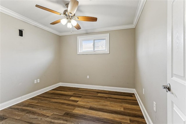 spare room featuring crown molding, dark wood-type flooring, and ceiling fan