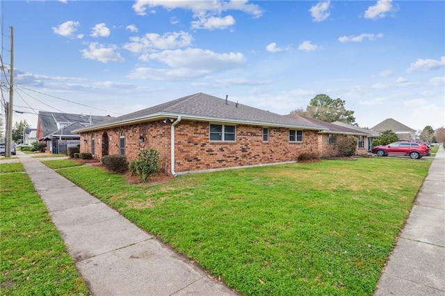 view of home's exterior with a lawn