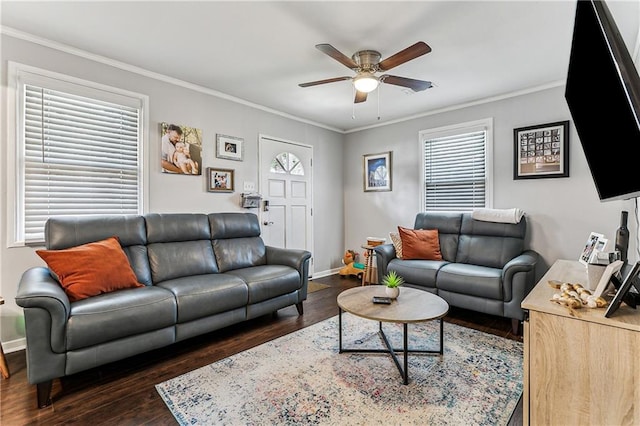 living room featuring crown molding, plenty of natural light, and dark hardwood / wood-style floors