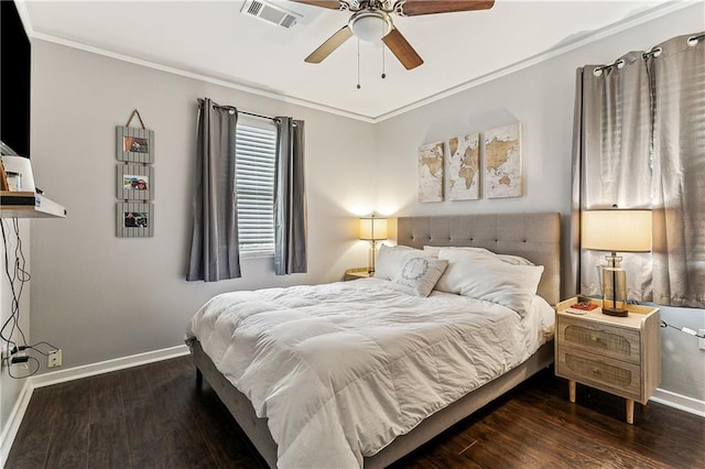 bedroom with ceiling fan, ornamental molding, and dark hardwood / wood-style flooring