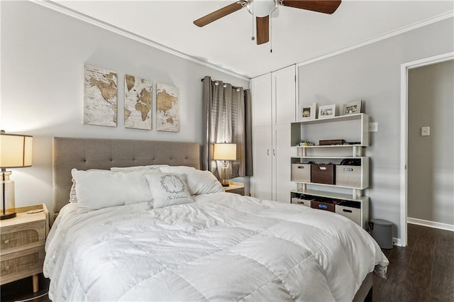 bedroom featuring ornamental molding, dark hardwood / wood-style floors, and ceiling fan