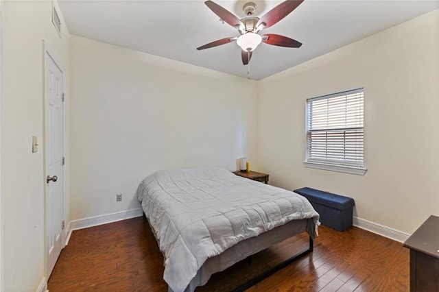 bedroom with dark wood-type flooring and ceiling fan